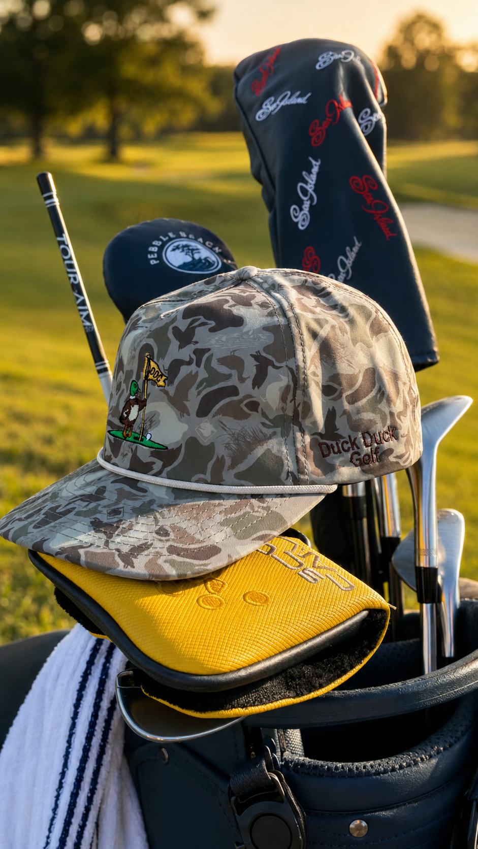 Camo rope hat resting on a golf bag at sunset